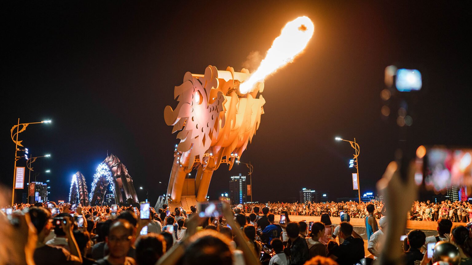 The Dragon Bridge breathing fire over the Han River during the weekend show in Da Nang