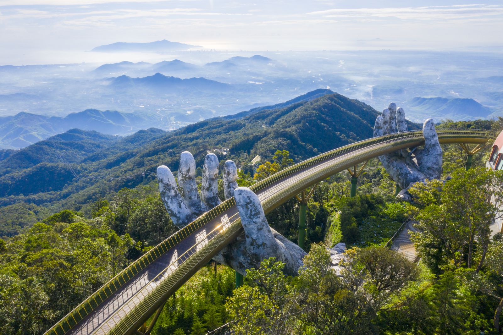 The Golden Bridge held up by two giant hands