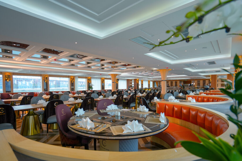 A table set for dinner in the dining room of a Ha Long Bay cruise