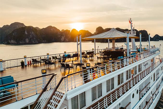 Sun loungers on the top deck of a luxury cruise ship in Ha Long Bay