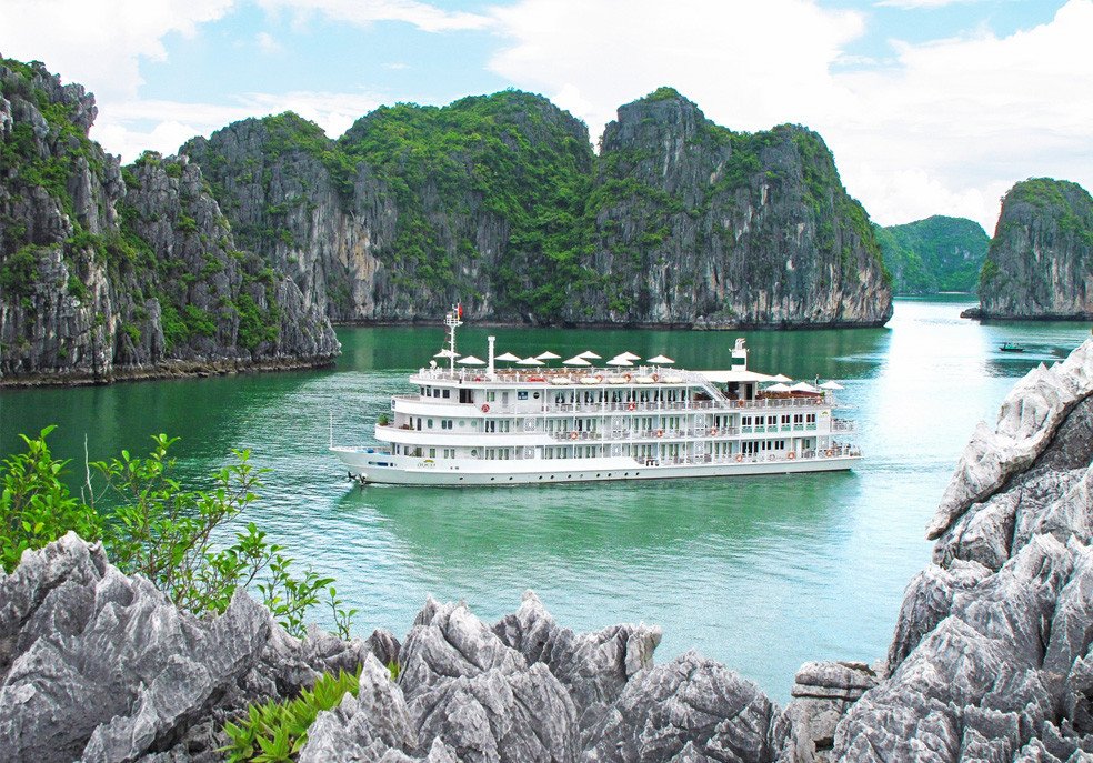 An overnight cruise boat among the limestone islands of Ha Long Bay