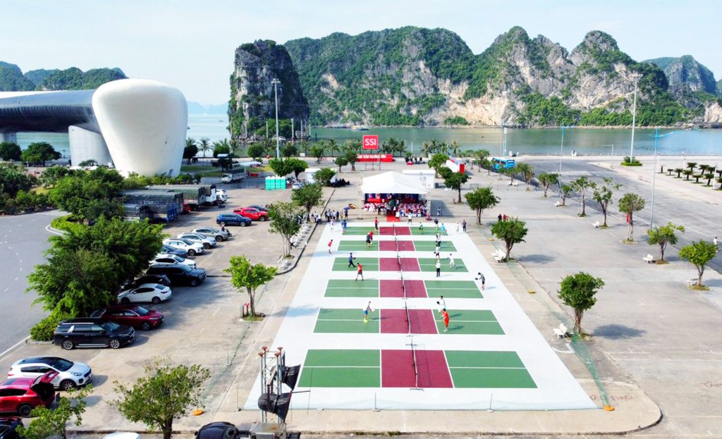 Pickleball courts set against the limestone karst mountains of Ha Long Bay, northern Vietnam