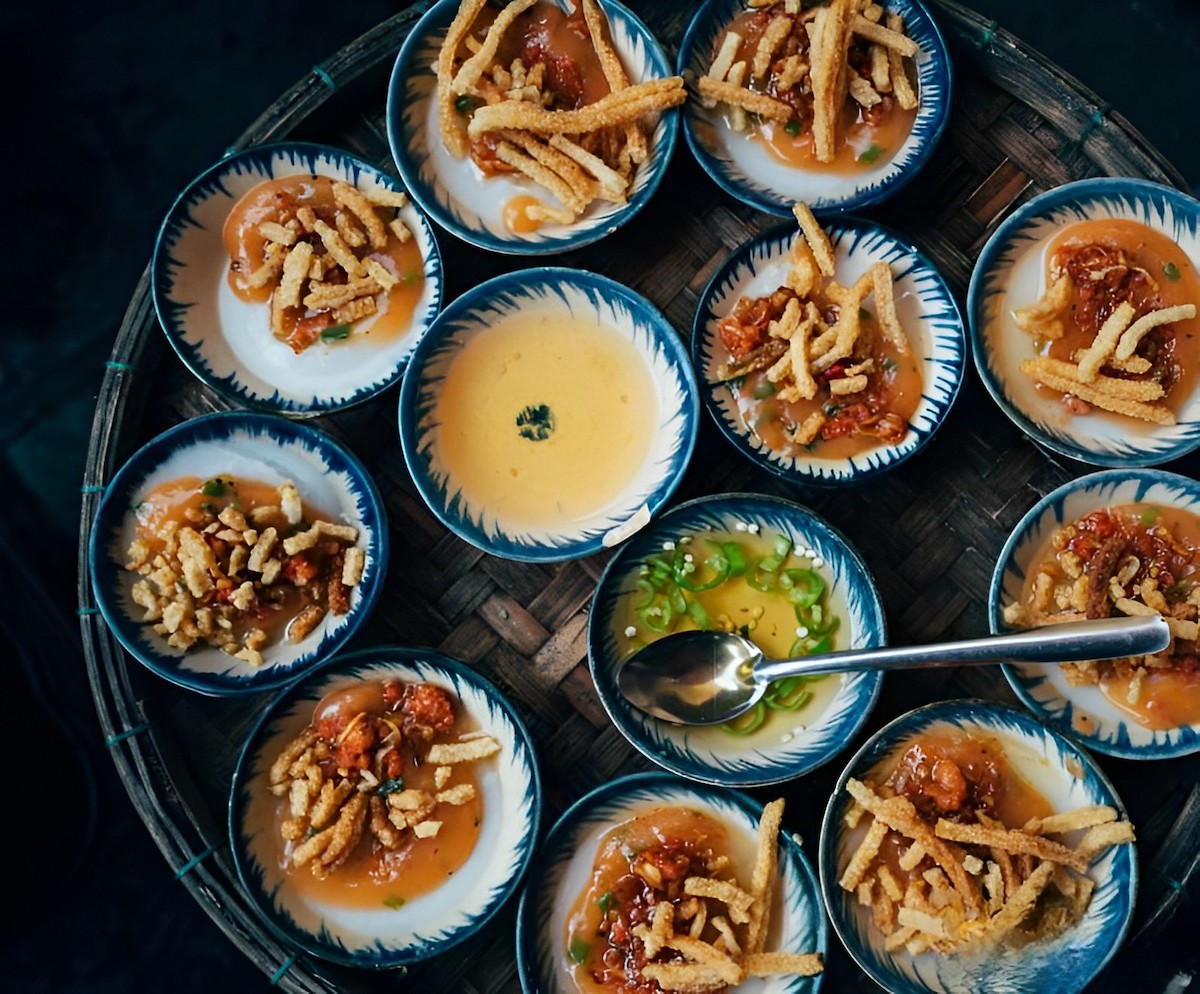 Small dishes of banh beo steamed rice cakes topped with shrimp in Hue