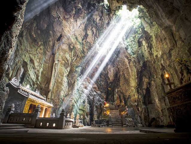 Sunlight streaming into a cave temple in the Marble Mountains near Da Nang, central Vietnam