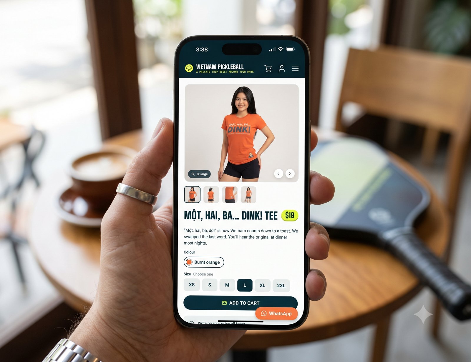 A hand holding a smartphone with a messaging app chat open