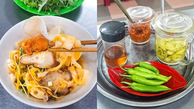 A bowl of mi quang noodles with herbs and chillies, the signature dish of Da Nang