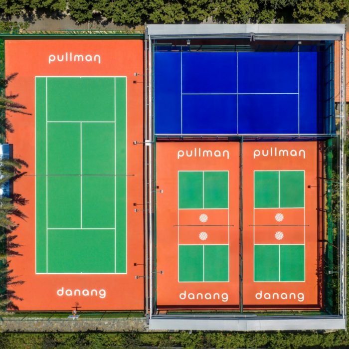 Aerial view of the pickleball and tennis courts at a beach resort in Da Nang