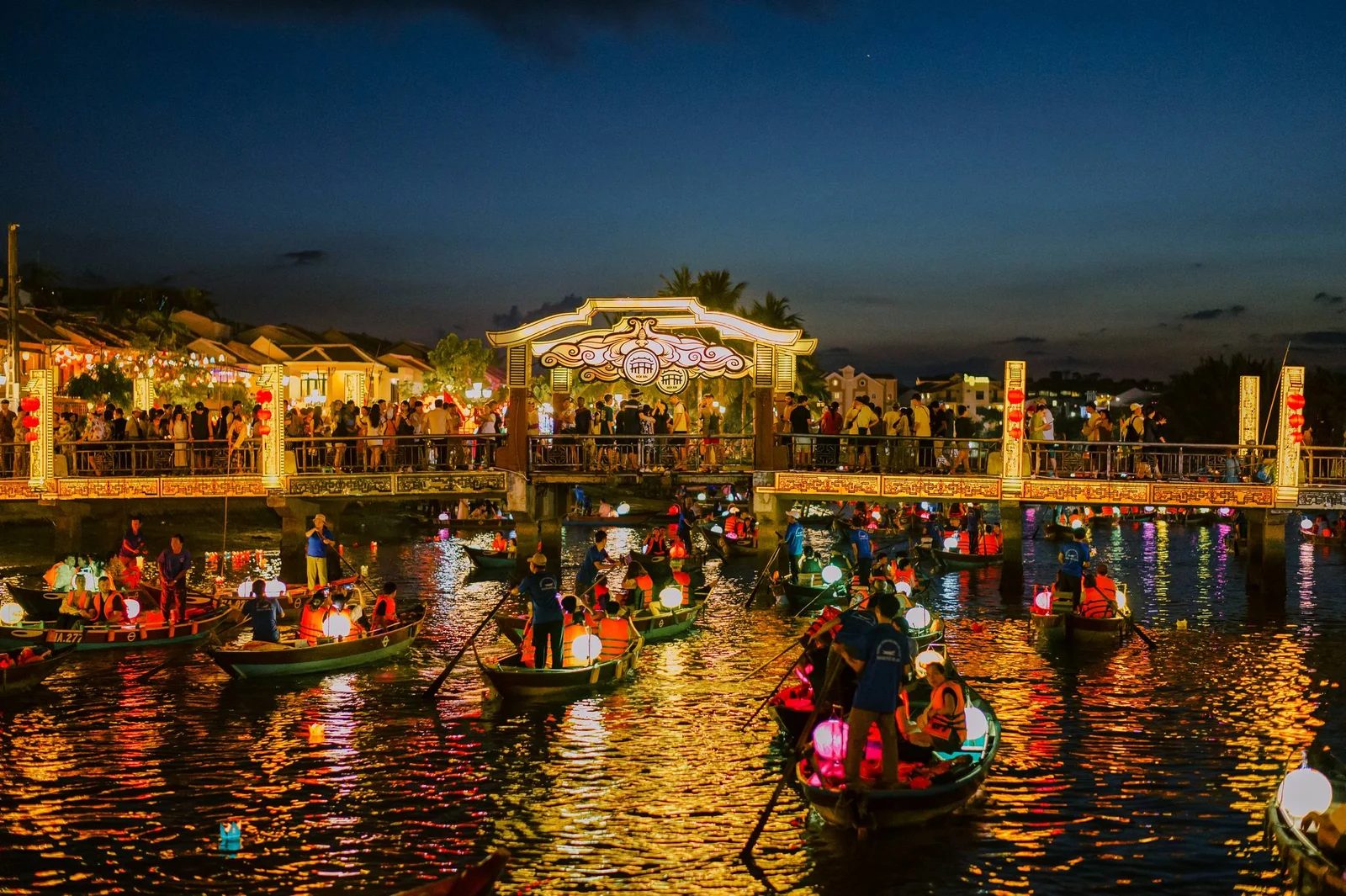 Lantern-lit boats on the river in Hoi An Ancient Town at night