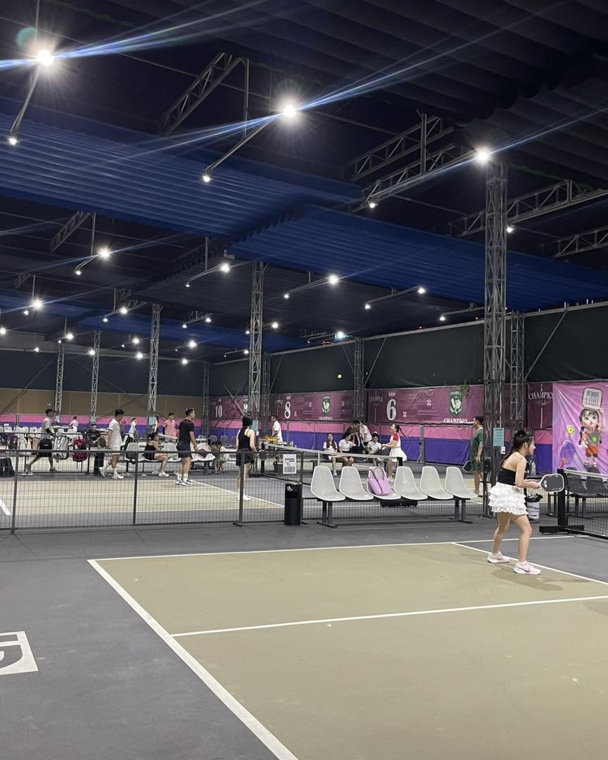 Playing pickleball on a court in Hanoi
